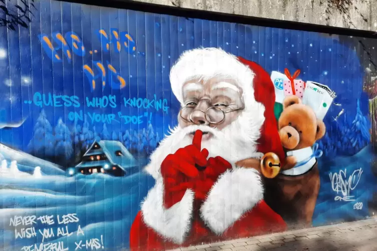Aktuelle Stra&szlig;enkunst: Weihnachtsmann mit Impfstoff. 