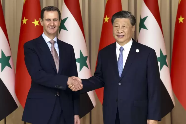 Händeschütteln der Staatschefs Xi Jinping (rechts) und Baschar al-Assad: China und Syrien wollen künftig enger kooperieren. 