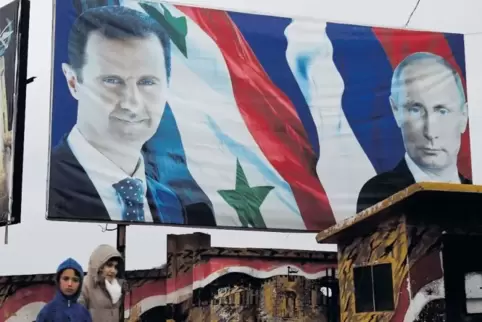 Alliierte: Russlands Präsident Putin (rechts) und Syriens Machthaber Assad auf einem Plakat in Aleppo. Der russische Kriegseinsa
