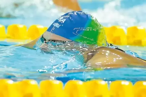 Ein Foto von den Olympischen Spielen in Peking: Schwimmerin und Wasser werden eins.